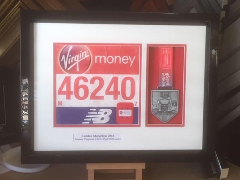 London Marathon Medal and Running Number presentation display for Dominc Chapman of the Beehive in White Waltham