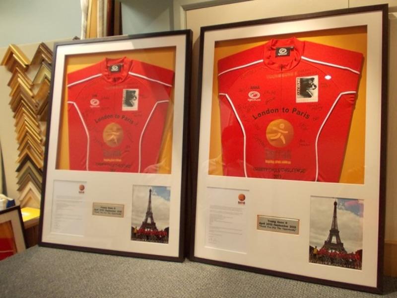Signed London to Paris Cycling Challenge Shirts in Box Frames.