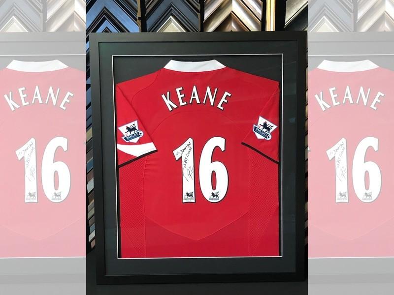 Manchester United shirt signed by Roy Keane, framed with a Matt black moulding, the shirt has been pinned and mounted and glazed with Tru Vue reflection control glass. Manchester United shirt signed by Roy Keane, framed with a Matt black moulding, the shirt has been pinned and mounted and glazed with Tru Vue reflection control glass.