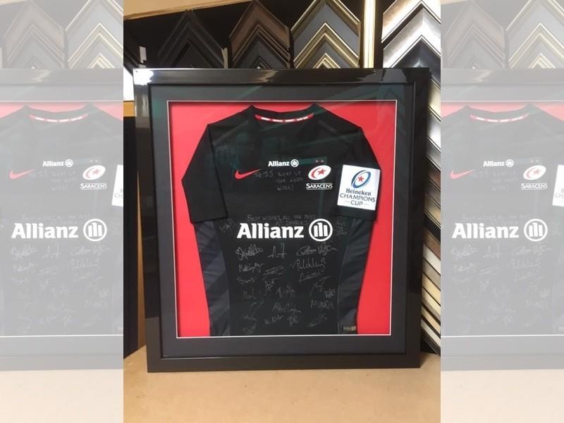 A signed Saracens RFC shirt, framed with a gloss black moulding, mounted and glazed with Tru Vue reflection control glass