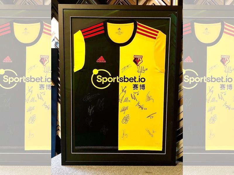 Signed Watford shirt, framed with a Matt black moulding, glazed with reflection control glass. Signed Watford shirt, framed with a Matt black moulding, glazed with reflection control glass.