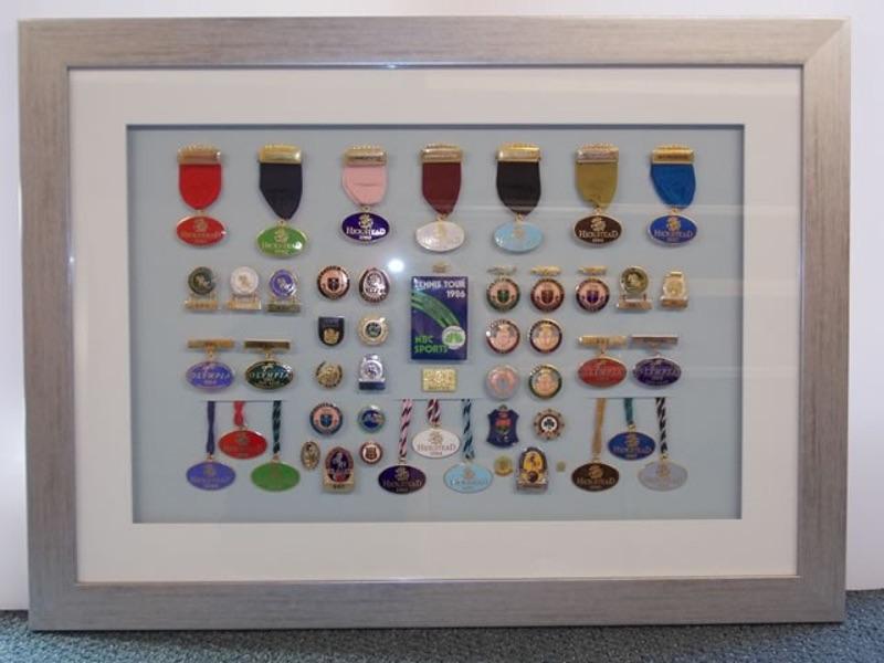 Collection of medals and pin badges collected over 40 years by a well known sports presenter.