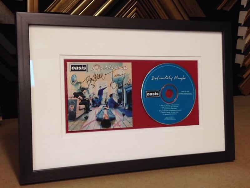 Oasis Definitely Maybe Signed CD Cover in a Boxed Frame