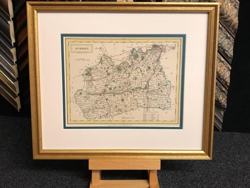 A late 19 century antique map of Surrey, traditionally framed with a distressed gold moulding, double mounted and glazed with Tru Vue reflection control glass.