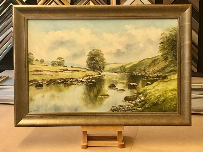 An original David Dean oil painting framed with a traditional gold/green moulding.